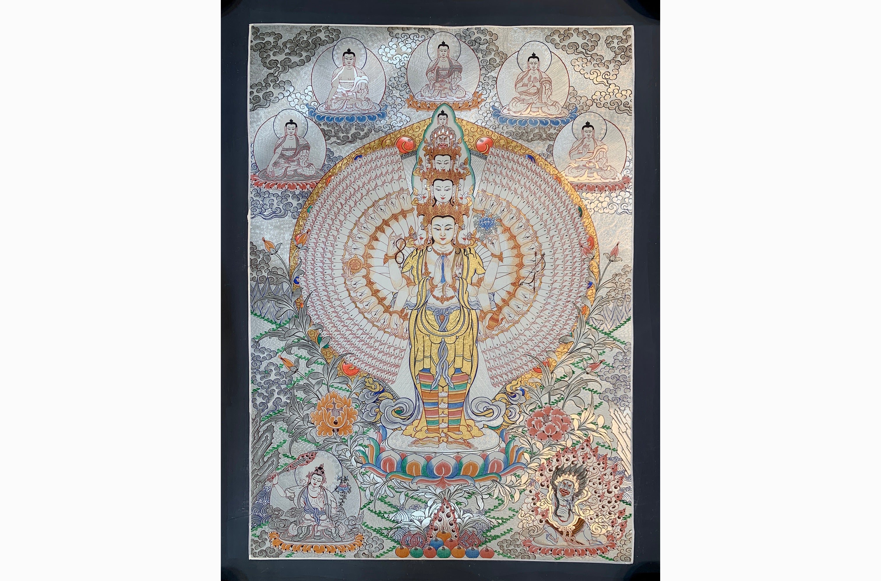 Hand painted SIlver and gold plated thousand armed avalokitesvara thangka painting.
