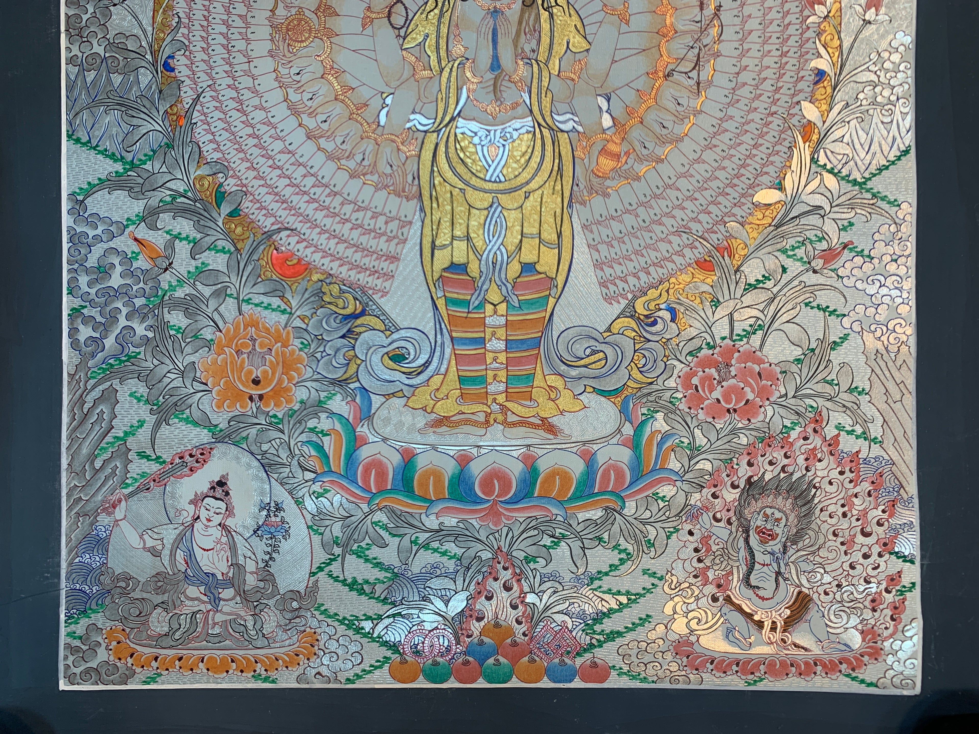 Hand painted SIlver and gold plated thousand armed avalokitesvara thangka painting.