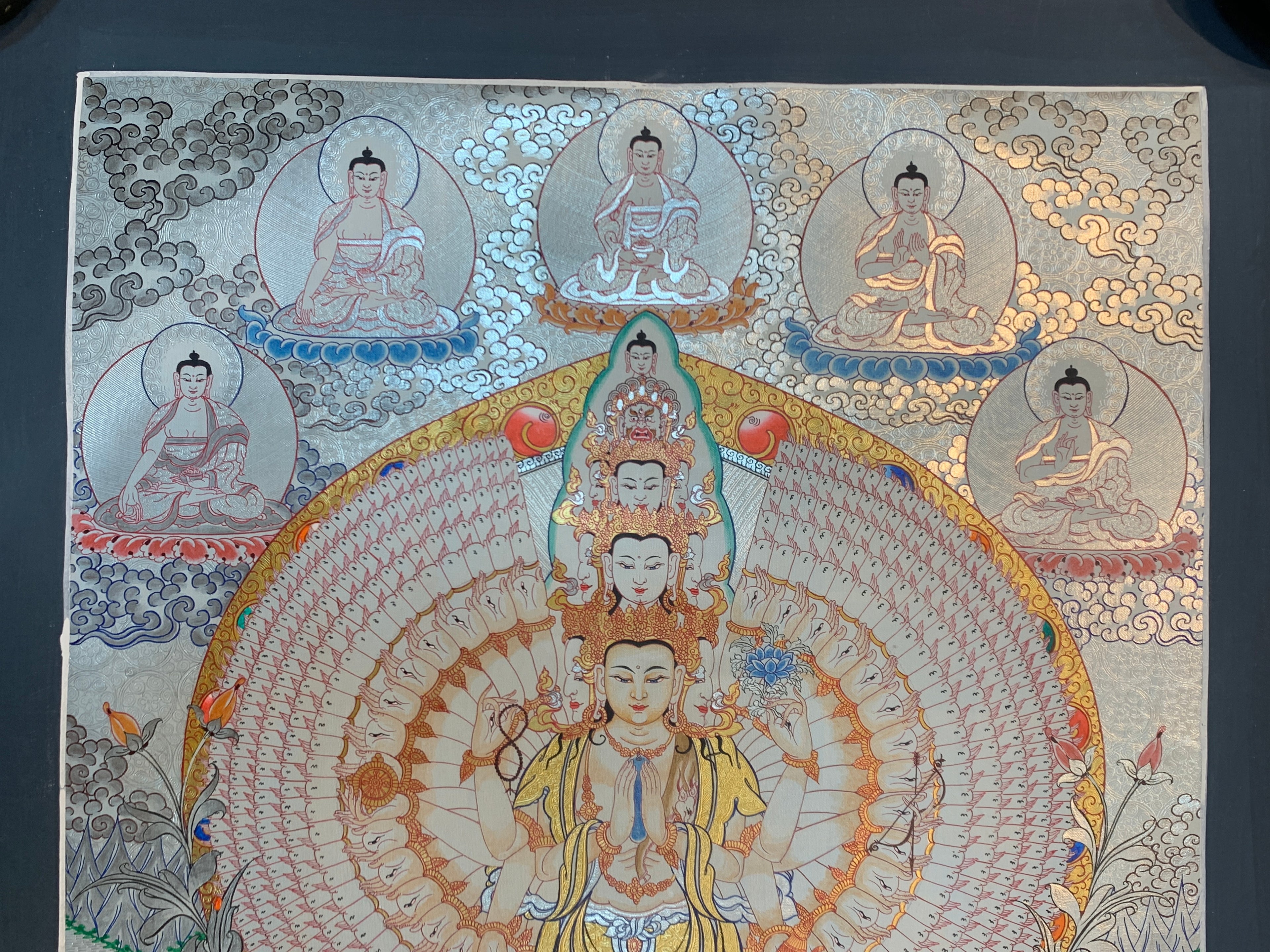 Hand painted SIlver and gold plated thousand armed avalokitesvara thangka painting.