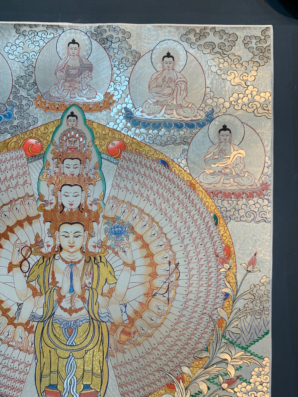 Hand painted SIlver and gold plated thousand armed avalokitesvara thangka painting.