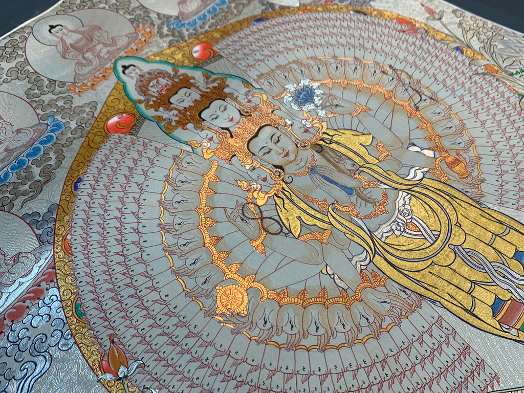 Hand painted SIlver and gold plated thousand armed avalokitesvara thangka painting.