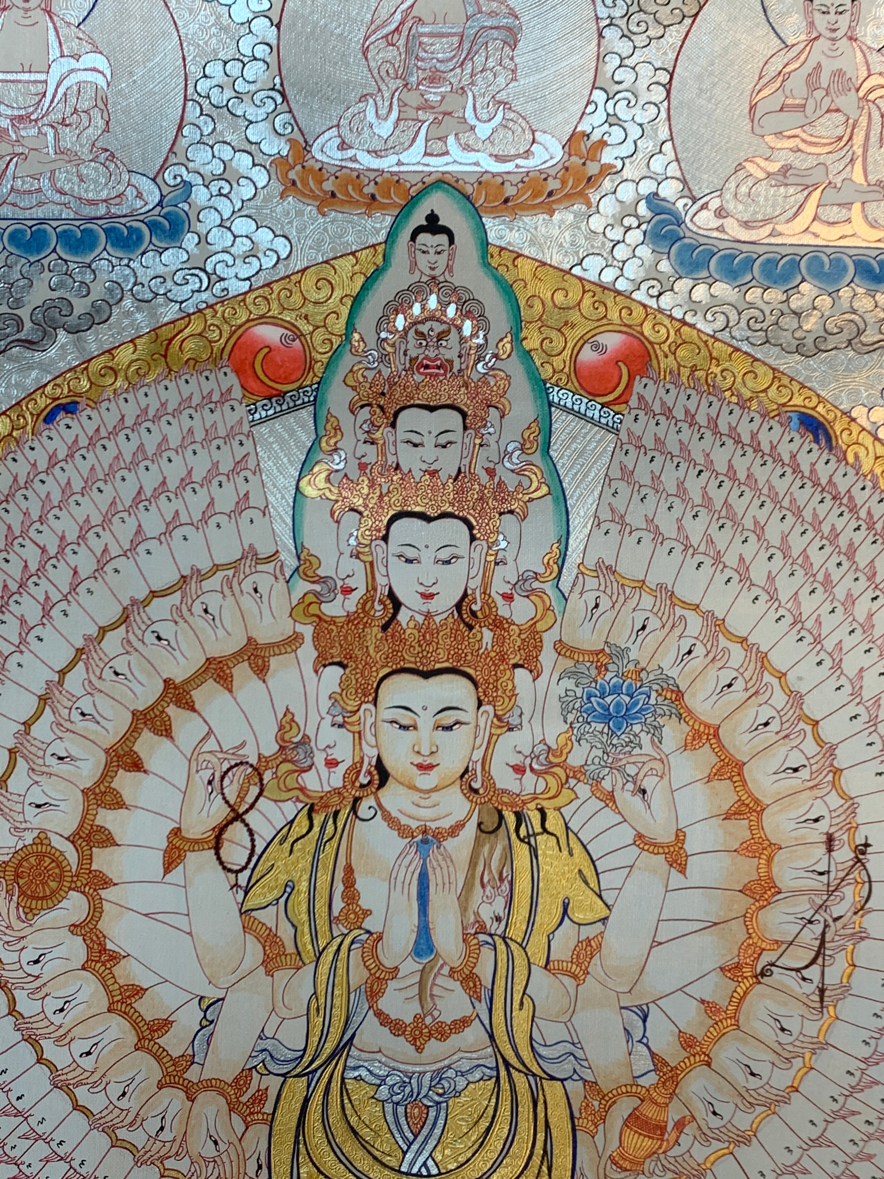 Hand painted SIlver and gold plated thousand armed avalokitesvara thangka painting.