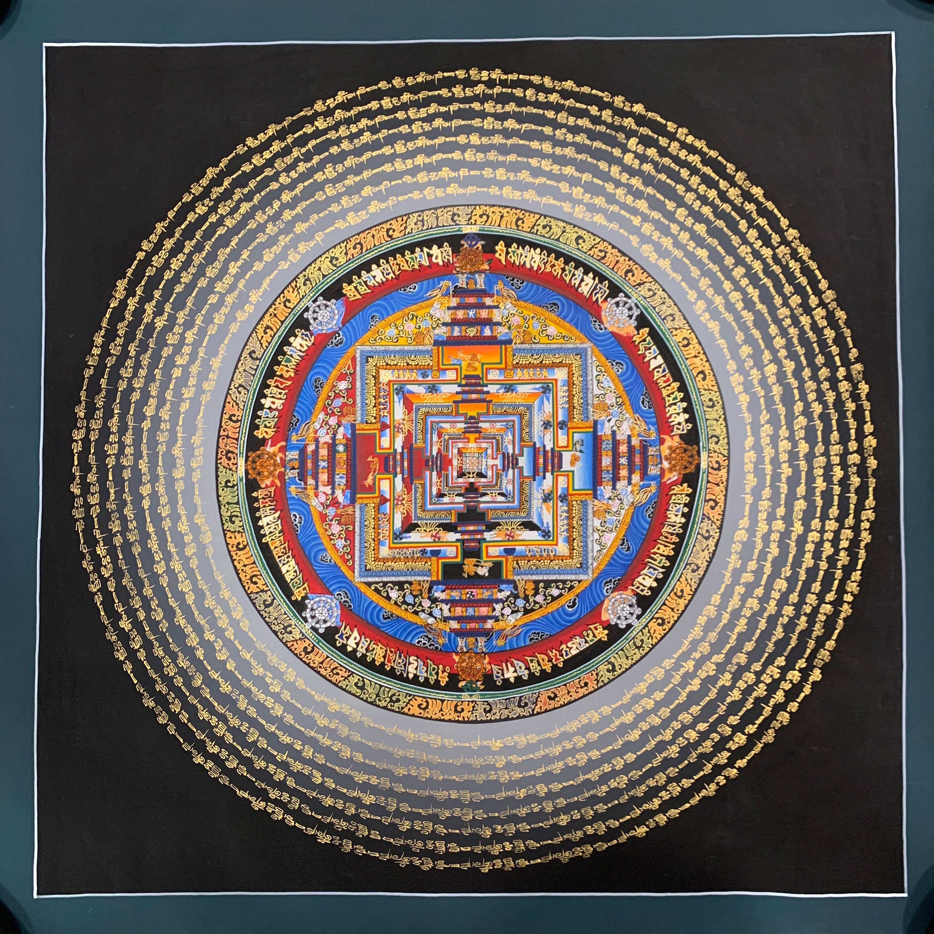 Kalachakra mandala thangka. hand painted wheel of time with mantra cycle.