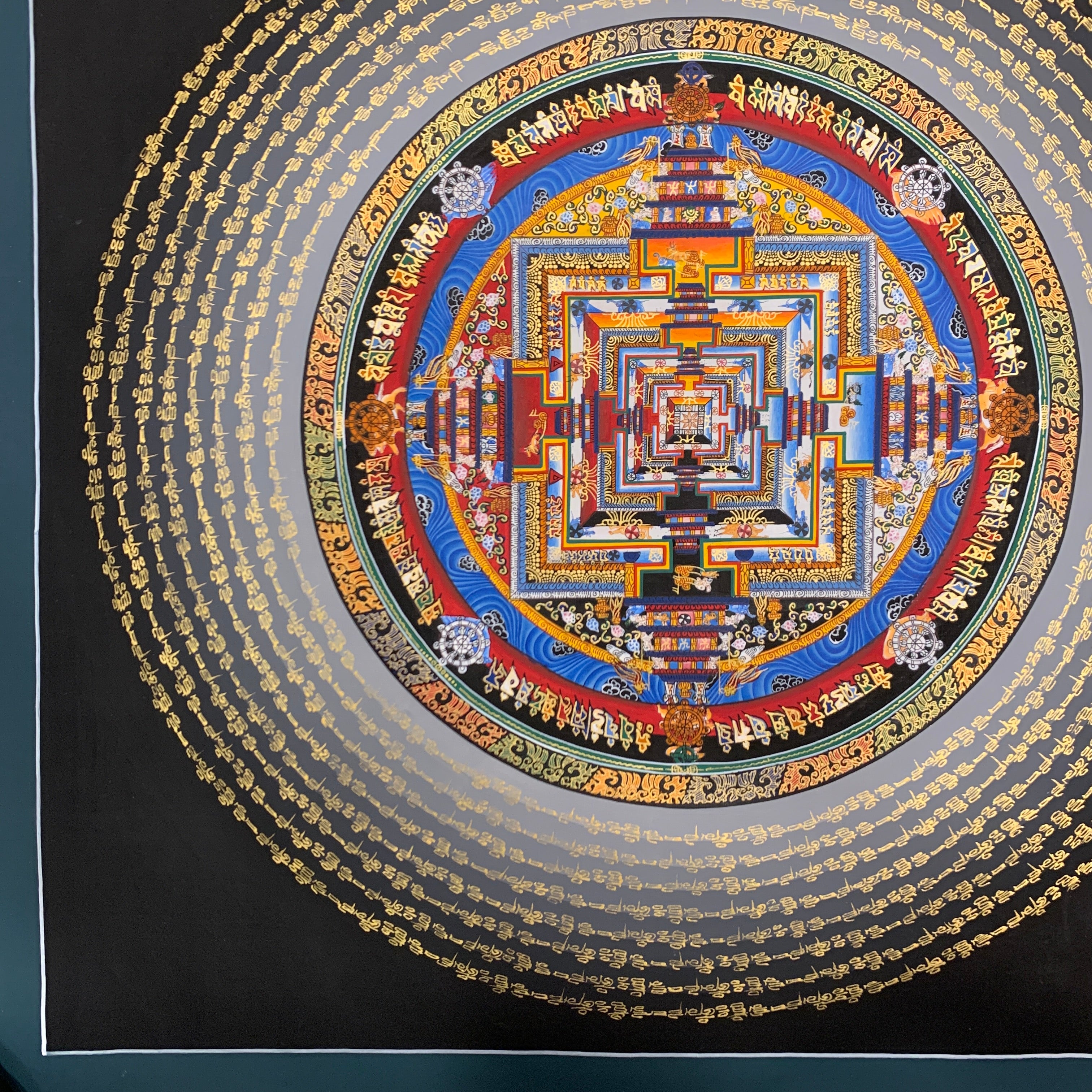 Kalachakra mandala thangka. hand painted wheel of time with mantra cycle.