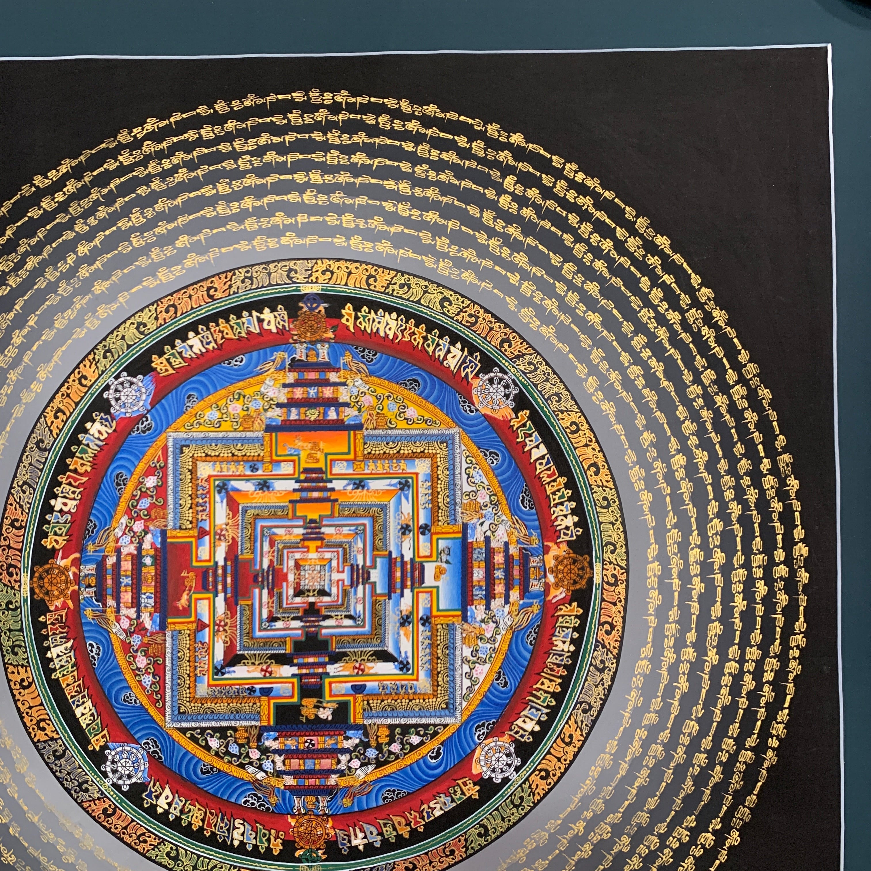 Kalachakra mandala thangka. hand painted wheel of time with mantra cycle.